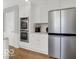 Kitchen with stainless steel refrigerator and built-in oven at 44 Horseshoe Ln, Carmel, IN 46033