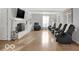 Spacious living room with a brick fireplace, built-in shelving, and cozy seating to create an inviting atmosphere at 44 Horseshoe Ln, Carmel, IN 46033