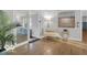 Sun-lit living room with hardwood floors, decor and furniture to create a peaceful and enjoyable atmosphere at 44 Horseshoe Ln, Carmel, IN 46033