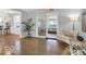 Cozy living room with hardwood floors, bright windows and furniture for relaxing or entertaining guests at 44 Horseshoe Ln, Carmel, IN 46033