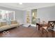 Cozy living room with neutral colors, wood floors and lots of sunlight at 44 Horseshoe Ln, Carmel, IN 46033
