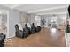 Bright living room with hardwood floors, art and comfortable recliners for relaxing and enjoying the space at 44 Horseshoe Ln, Carmel, IN 46033
