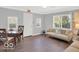 Living room with neutral color paint, hard wood floors and ample natural light at 44 Horseshoe Ln, Carmel, IN 46033