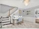 Bright office space with a modern desk, staircase, and stylish chandelier at 44 Horseshoe Ln, Carmel, IN 46033