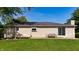 Backyard view with patio set and sliding door, nestled in lush greenery at 453 N 275 E, Columbus, IN 47203