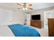 Bedroom featuring neutral walls, carpet, and a television above a dresser at 453 N 275 E, Columbus, IN 47203