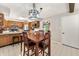 Open dining area with dark wood table and chairs, adjacent to kitchen with stainless steel appliances at 453 N 275 E, Columbus, IN 47203