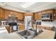The kitchen features oak cabinets, stainless steel appliances, and a double basin sink at 453 N 275 E, Columbus, IN 47203