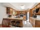 The kitchen has oak cabinets and a stainless steel refrigerator and a double basin sink at 453 N 275 E, Columbus, IN 47203