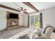 The living room has a brick fireplace and sliding glass doors at 453 N 275 E, Columbus, IN 47203