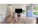 Bright living room with hardwood floors, a decorative fireplace, and stylish furnishings, showing a calming entrance at 453 N 275 E, Columbus, IN 47203