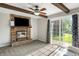 Cozy living room with fireplace, exposed beams, and a sliding glass door at 453 N 275 E, Columbus, IN 47203