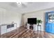 Spacious living room with hardwood floors, modern furniture, with a fireplace, and ample natural light at 453 N 275 E, Columbus, IN 47203
