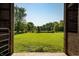 View from outbuilding of sprawling green pasture surrounded by mature trees at 453 N 275 E, Columbus, IN 47203