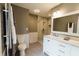 Bright bathroom featuring a vanity with marble countertop and glass enclosed shower at 46 Hawthorne Ct, Carmel, IN 46033