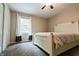 Bedroom includes a white-painted bed frame and closet, along with a sunny window view at 46 Hawthorne Ct, Carmel, IN 46033