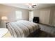 Bedroom featuring neutral colors, a ceiling fan, carpet, and closet at 46 Hawthorne Ct, Carmel, IN 46033