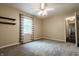 Bedroom with carpeted floors, a ceiling fan, and plenty of light at 46 Hawthorne Ct, Carmel, IN 46033