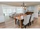 An open-concept view showcasing the dining room adjacent to the living area, perfect for entertaining guests at 46 Hawthorne Ct, Carmel, IN 46033