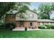 Charming two-story home with brick and siding facade, complemented by a well-manicured lawn at 46 Hawthorne Ct, Carmel, IN 46033