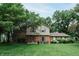 Charming two-story home boasts a well-manicured lawn and mature trees, enhancing its curb appeal at 46 Hawthorne Ct, Carmel, IN 46033