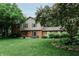 Charming two-story home with a well-manicured lawn, mature trees, and a brick and siding facade at 46 Hawthorne Ct, Carmel, IN 46033