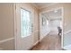 Inviting foyer with decorative glass door and hardwood floors leading to the living areas at 46 Hawthorne Ct, Carmel, IN 46033