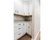 Corner of a kitchen featuring granite countertops, white cabinets and black hardware at 46 Hawthorne Ct, Carmel, IN 46033