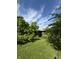 View of backyard with mature trees at 4609 Andover Rd, Indianapolis, IN 46226
