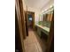 Vintage bathroom with green tile, a unique vanity, and tiled flooring at 4609 Andover Rd, Indianapolis, IN 46226