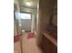 A vintage bathroom showcasing patterned wallpaper and original fixtures at 4609 Andover Rd, Indianapolis, IN 46226