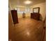Ample-sized bedroom showcasing light-toned walls and hardwood floors at 4609 Andover Rd, Indianapolis, IN 46226