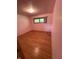 Standard bedroom with hardwood floors and window views at 4609 Andover Rd, Indianapolis, IN 46226