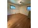 A bright bedroom features hardwood floors and windows at 4609 Andover Rd, Indianapolis, IN 46226