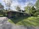 Ranch home with lush ivy, and driveway with a large yard, with trees and a peaceful, inviting setting at 4609 Andover Rd, Indianapolis, IN 46226
