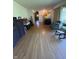 Spacious foyer showcasing hardwood flooring, with vintage furniture and multiple windows at 4609 Andover Rd, Indianapolis, IN 46226