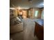Inviting living room with wood paneling, carpet, and vintage furniture at 4609 Andover Rd, Indianapolis, IN 46226