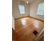 Sunlit bedroom with beautiful hardwood floors and simple, clean design at 472 N 17Th St, Noblesville, IN 46060