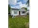 Charming single-story home with a well-maintained lawn and stone landscaping at 472 N 17Th St, Noblesville, IN 46060