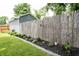 The backyard features a well-maintained lawn, with a garden that adds a splash of color at 4927 Caroline Ave, Indianapolis, IN 46205