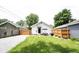 This large backyard offers outdoor dining space and a manicured lawn, perfect for entertaining and relaxation at 4927 Caroline Ave, Indianapolis, IN 46205