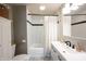 Bathroom with subway tile, a vanity and a shower with white curtain at 4927 Caroline Ave, Indianapolis, IN 46205