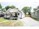 Charming home with a welcoming front porch, enhancing the curb appeal of the property at 4927 Caroline Ave, Indianapolis, IN 46205
