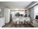 Kitchen with bar seating, stainless steel appliances and granite countertops at 4927 Caroline Ave, Indianapolis, IN 46205