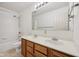 Bathroom featuring a double sink vanity with a shower and tub combination at 5269 Deer Creek Dr, Indianapolis, IN 46254