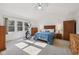 Bright bedroom with natural light, ceiling fan, neutral carpeting, and plenty of closet space at 5269 Deer Creek Dr, Indianapolis, IN 46254