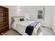 Inviting bedroom with a cozy bed, side table, and ample natural light from the window at 5269 Deer Creek Dr, Indianapolis, IN 46254