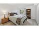Cozy bedroom with a comfortable bed, side table, and a bookshelf by the window at 5269 Deer Creek Dr, Indianapolis, IN 46254