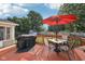 Outdoor deck featuring a grill and table with umbrella, ideal for outdoor dining and relaxation at 5269 Deer Creek Dr, Indianapolis, IN 46254