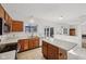 Bright kitchen featuring an island, wooden cabinets, and modern appliances at 5269 Deer Creek Dr, Indianapolis, IN 46254